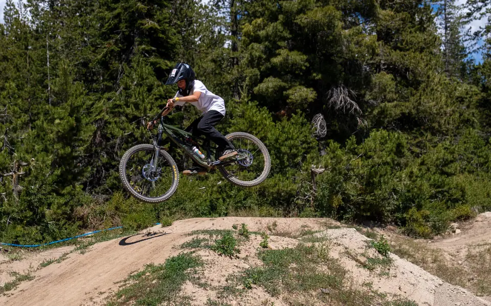 MTB Camper hitting the dirt pump tracks at Woodward Tahoe